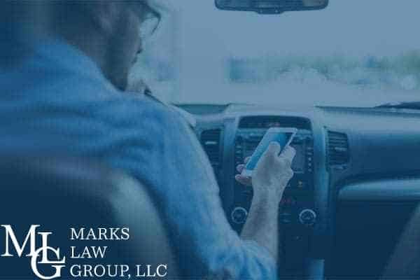 person texting and driving marks law group