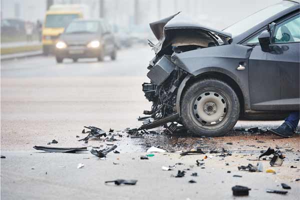 A car with extensive damage to its front after an accident.