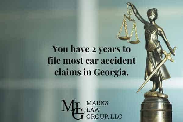 image of the statue of justice with information on how long you have to file a car accident claim in Georgia