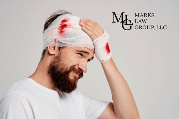 man holding his head after an injury, Seeking Compensation For A Brain Injury