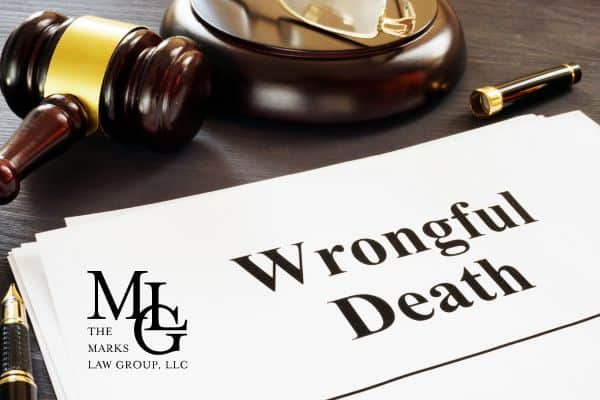 a wrongful death lawsuit next to a gavel