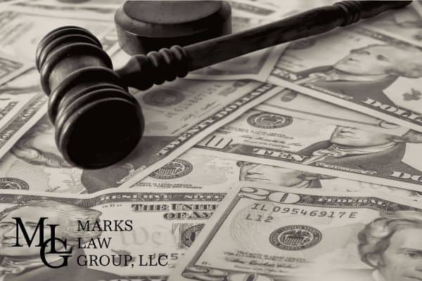 money from a wrongful death lawsuit with a gavel on top