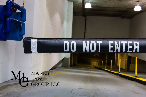 a sign that says "do not enter" at a parking garage