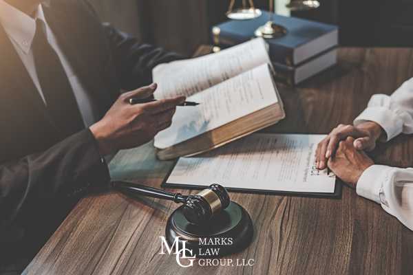 a man discussing a negligence claim with an attorney